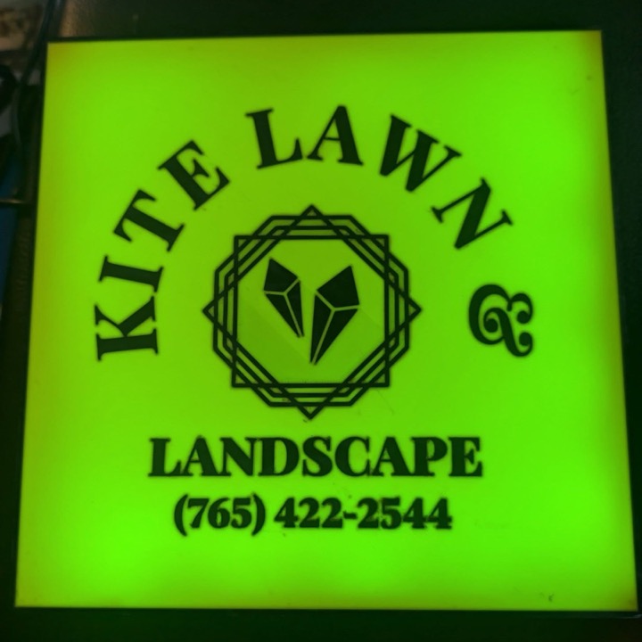 3D printed square sign glowing bright green with a lawn and landscape company name and phone number