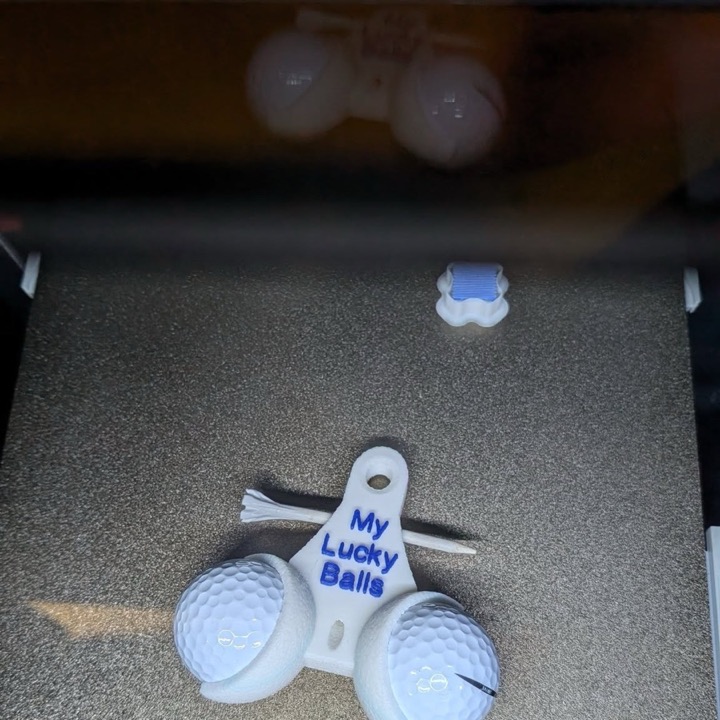 3D printed golf tee and ball holder with a custom message